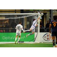 Rhode Island FC goalkeeper Koke Vegas swats away at Loudoun United FC shot