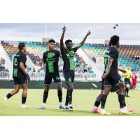 Lexington SC midfielder Ates Diouf celebrates