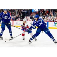 Syracuse Crunch defenseman Steven Santini (right) vs. the Laval Rocket