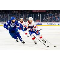 Syracuse Crunch defenseman Steven Santini (left) vs. the Laval Rocket