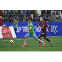 Seattle Sounders FC'd Paul Rothrock and Portland Timbers' Zac McGraw in action