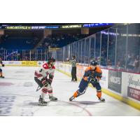 Rapid City Rush defenseman Zack Hoffman (left) vs. the Tulsa Oilers