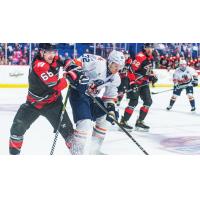 Tulsa Oilers forward Ruslan Gazizov (center)