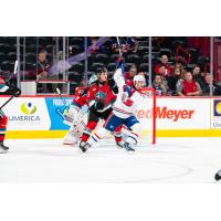 Ethan Mittelstadt of the Kelowna Rockets defends against the Spokane Chiefs