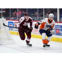 Peterborough Petes right wing Nico Addy (left) vs. the Flint Firebirds