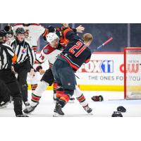 Tucson Roadrunners defenseman Montana Onyebuchi drops the gloves against Coachella Valley forward Ian McKinnon