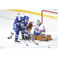 Syracuse Crunch's Dylan Duke battles Rochester Americans' Jack Rathbone and Devon Levi