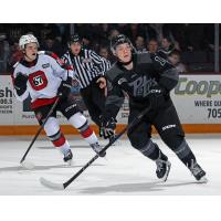 Peterborough Petes centre Adam Levac (right) against the Ottawa 67's